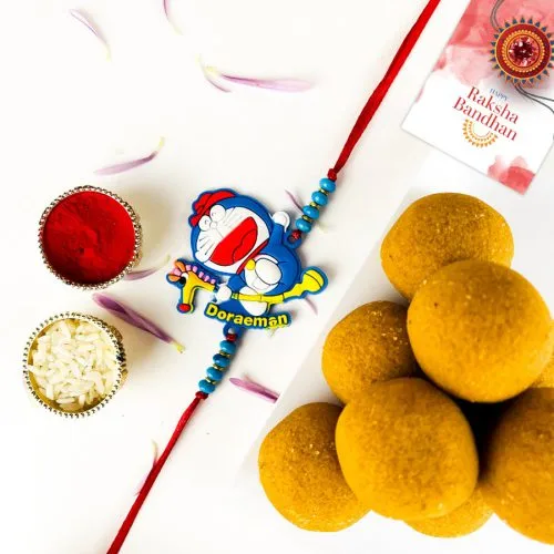 Charming Doraemon Rakhi & Ladoo Surprise Charming Doraemon Rakhi & Ladoo Surprise