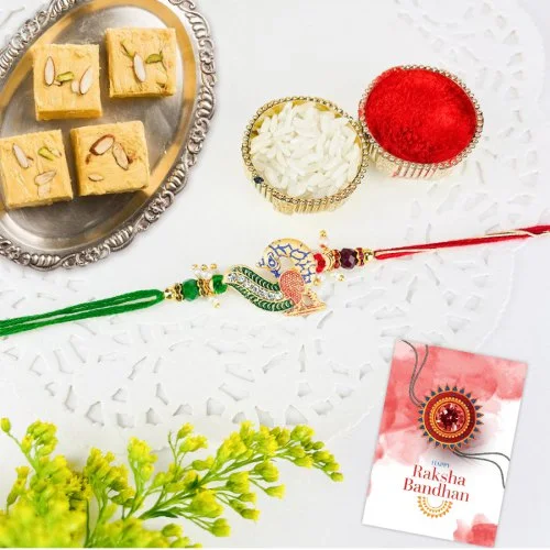 Mesmerizing Peacock Rakhi and Soan Papdi Treat Mesmerizing Peacock Rakhi and Soan Papdi Treat